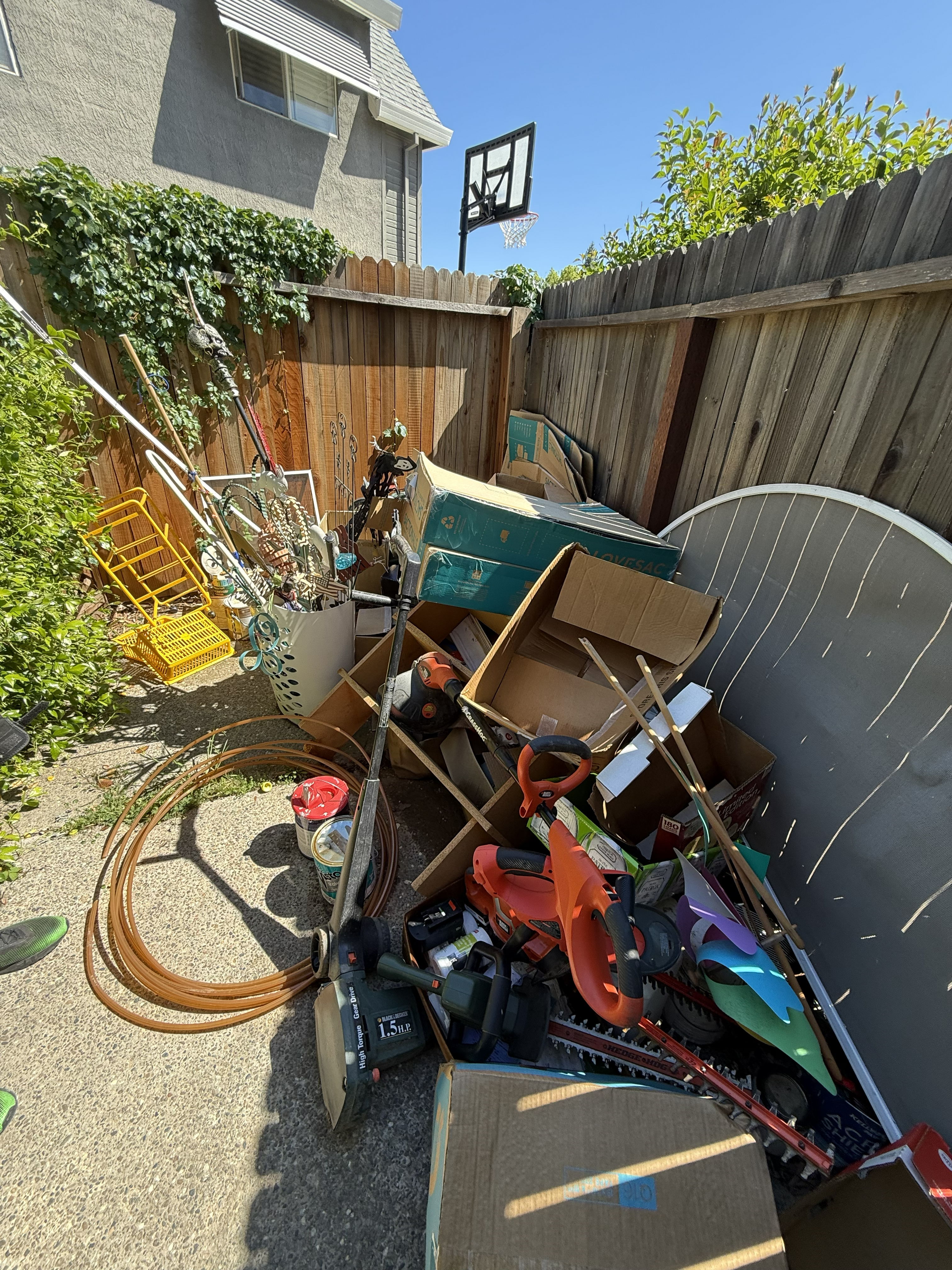 Cluttered junk pile before removal - Job 1