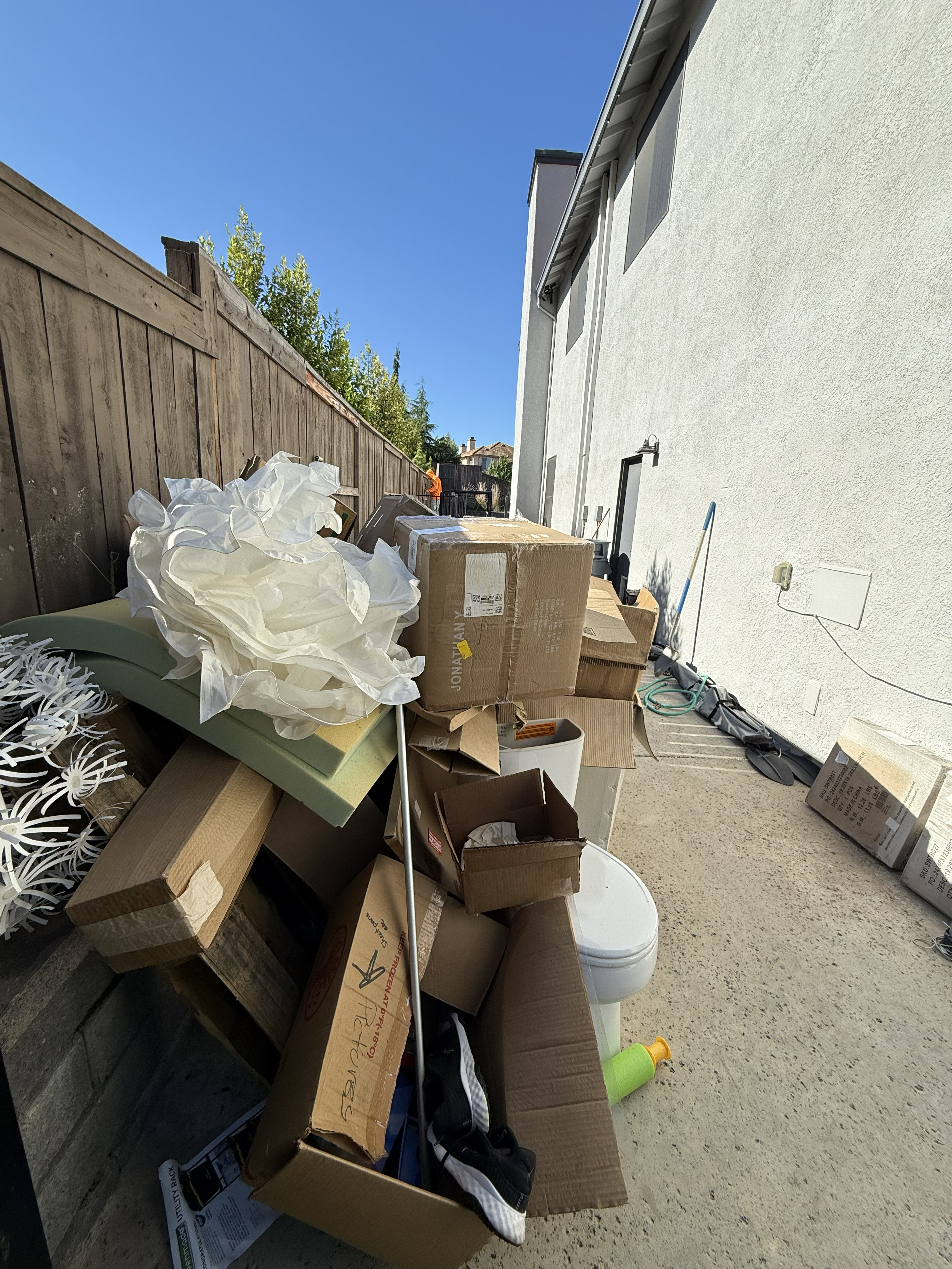 Pile of debris and junk in backyard before cleanout - Job 2