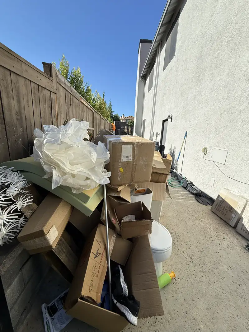 Pile of debris and junk in backyard before cleanout - Job 2