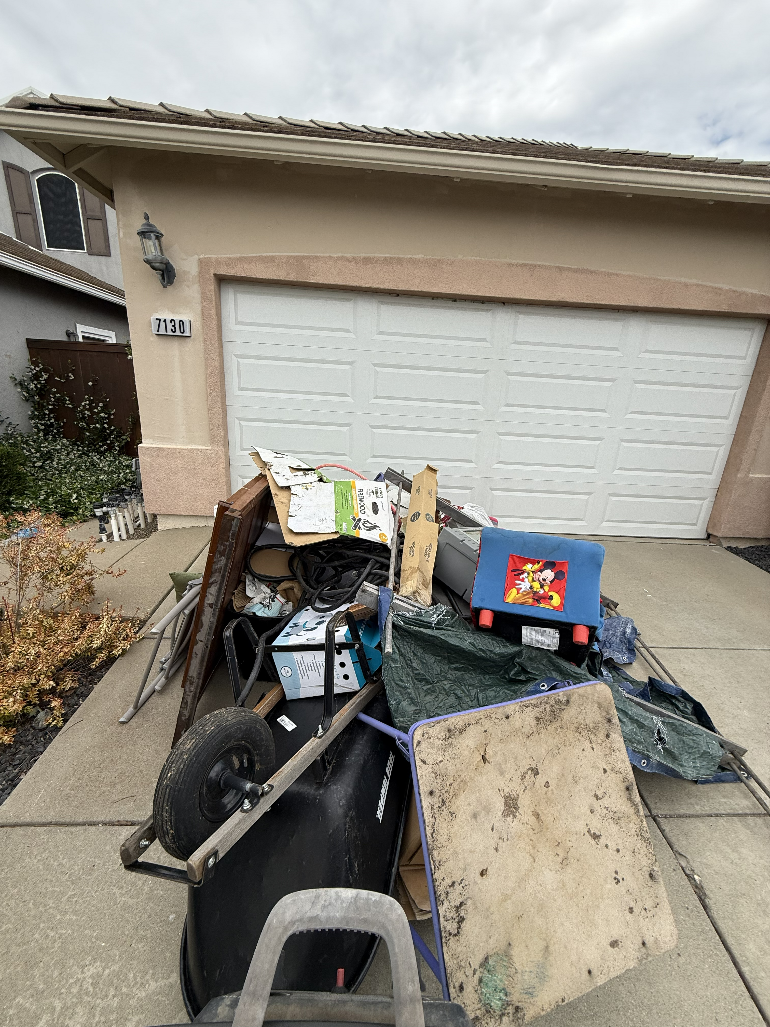 Accumulated yard waste and trash piles before cleanup - Job 4