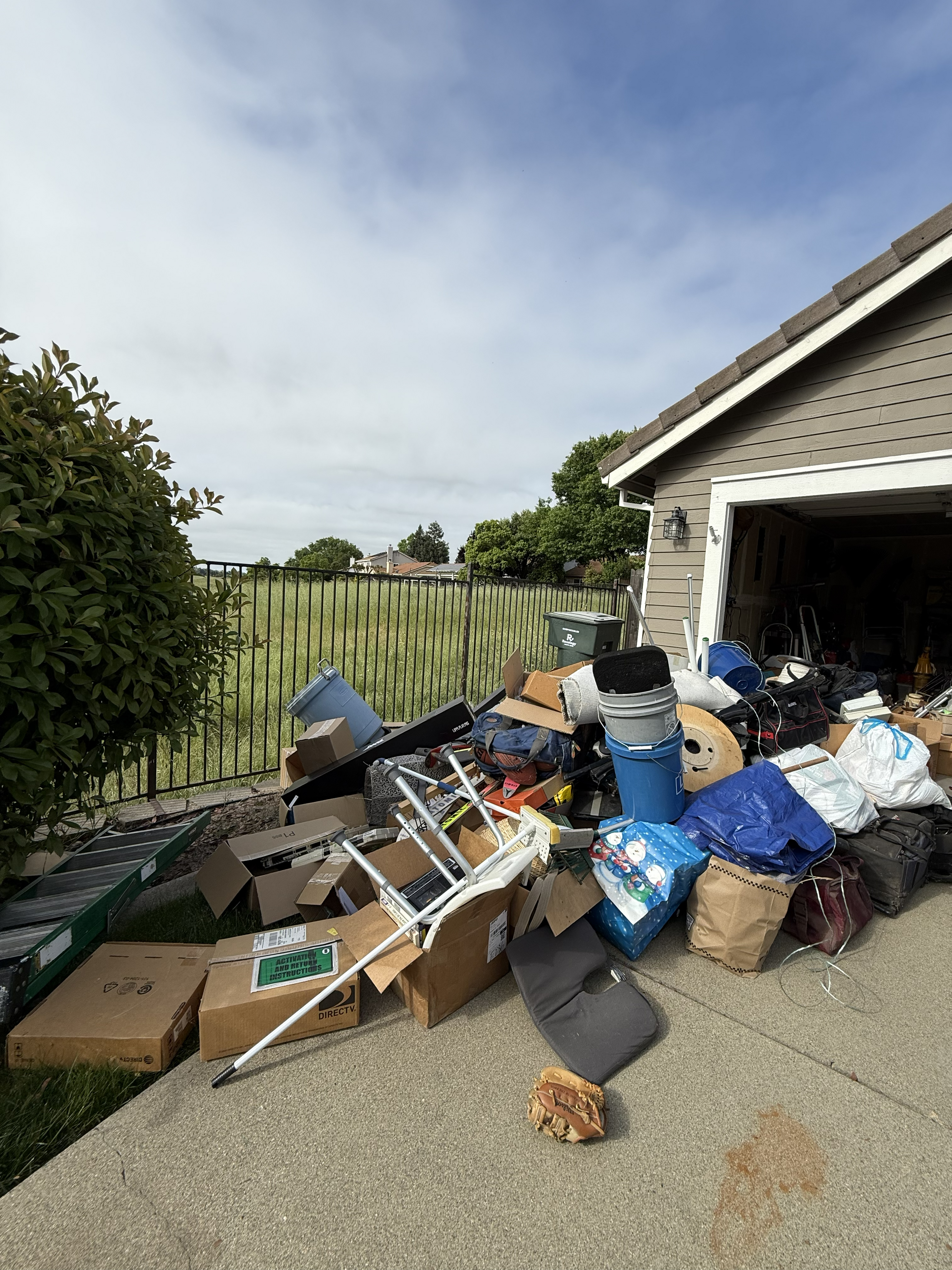 Cluttered storage room or backyard trash before cleanup - Job 6
