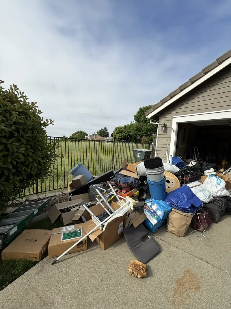 Cluttered storage room or backyard trash before cleanup - Job 6
