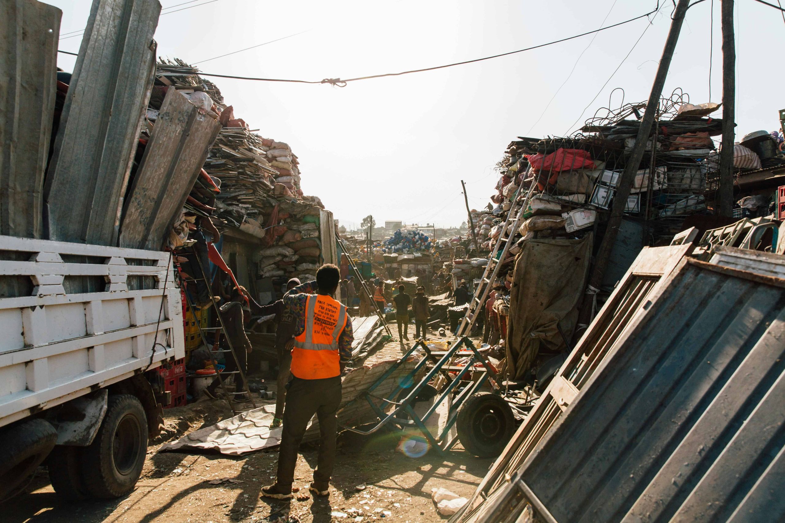 An image of Kales Junk & Trash Hauling picking up garbage from a constructions site.